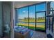 Screened lanai overlooking the water and golf course offers a tranquil outdoor living space at 12440 Wellen Golf St # 105, Venice, FL 34293