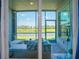 Screened lanai offers peaceful views of the water and golf course at 12440 Wellen Golf St # 105, Venice, FL 34293