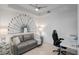 Stylish living room with unique golf decor, comfortable seating, and a modern desk area at 12440 Wellen Golf St # 105, Venice, FL 34293