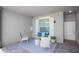 Inviting outdoor patio featuring stylish seating, a patterned rug, and a welcoming ambiance at 12440 Wellen Golf St # 105, Venice, FL 34293