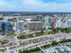 A scenic aerial view of a coastal city showcasing modern architecture, waterfront access and a marina at 1255 N Gulfstream Ave # 402, Sarasota, FL 34236