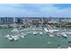 Stunning aerial view of a waterfront condo building and a marina filled with boats at 1255 N Gulfstream Ave # 402, Sarasota, FL 34236