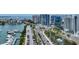 Aerial view of waterfront condos, showcasing road access and surrounding community at 1255 N Gulfstream Ave # 402, Sarasota, FL 34236
