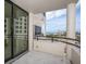 Inviting balcony area with columns and views of the marina at 1255 N Gulfstream Ave # 402, Sarasota, FL 34236