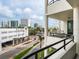 Balcony view features cityscapes, palm trees, and architectural details, providing an urban oasis at 1255 N Gulfstream Ave # 402, Sarasota, FL 34236