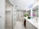 Spa-like bathroom features dual sinks, illuminated mirrors, and marble accents for modern luxury at 1255 N Gulfstream Ave # 402, Sarasota, FL 34236