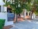Bay Plaza entrance with professional landscaping, clear signage, and accessibility ramp at 1255 N Gulfstream Ave # 402, Sarasota, FL 34236