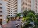 Beautiful landscaping at the Bay Plaza's entrance, with covered drive and circular driveway at 1255 N Gulfstream Ave # 402, Sarasota, FL 34236