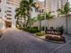 Beautifully landscaped entrance to Bay Plaza with brick paving and elegant signage at 1255 N Gulfstream Ave # 402, Sarasota, FL 34236