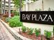 Attractive Bay Plaza sign surrounded by colorful landscaping and greenery at 1255 N Gulfstream Ave # 402, Sarasota, FL 34236