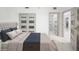 Comfortable bedroom boasts marble floors, a sliding door closet, and an ensuite bathroom at 1255 N Gulfstream Ave # 402, Sarasota, FL 34236