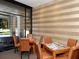 Relaxing common room with tables, chairs, and a view of the outdoors at 1255 N Gulfstream Ave # 402, Sarasota, FL 34236