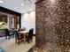 Inviting common room with tables, chairs, and decorative mosaic wall at 1255 N Gulfstream Ave # 402, Sarasota, FL 34236