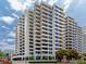 A contemporary condominium building featuring sleek balconies, expansive windows and city views at 1255 N Gulfstream Ave # 402, Sarasota, FL 34236