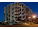 A multi-story condominium with many balconies on a clear night at 1255 N Gulfstream Ave # 402, Sarasota, FL 34236