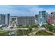 Modern condo building near a pond and waterfront, offering city living at 1255 N Gulfstream Ave # 402, Sarasota, FL 34236