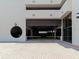 An entrance to a parking garage with a black circular architectural detail on the side at 1255 N Gulfstream Ave # 402, Sarasota, FL 34236