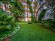 Lush community green space with seating and views of the condominium at 1255 N Gulfstream Ave # 402, Sarasota, FL 34236