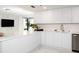 Stylish kitchen features white marble countertops, modern appliances, and an abundance of cabinet space at 1255 N Gulfstream Ave # 402, Sarasota, FL 34236