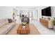 Contemporary living room featuring stylish decor, bright lighting, and seamless open space at 1255 N Gulfstream Ave # 402, Sarasota, FL 34236