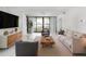Bright living room with marble floors, modern furniture, and a view of the city at 1255 N Gulfstream Ave # 402, Sarasota, FL 34236