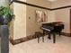 Elegant lobby area featuring a grand piano and modern decor at 1255 N Gulfstream Ave # 402, Sarasota, FL 34236