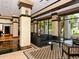 Stylish lobby with comfortable seating, large windows, decorative columns and patterned flooring at 1255 N Gulfstream Ave # 402, Sarasota, FL 34236