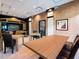Bright meeting room with modern tables, chairs and a large TV at 1255 N Gulfstream Ave # 402, Sarasota, FL 34236