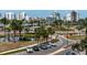 Cityscape view of Bay Plaza with palm trees, parking, and waterfront buildings at 1255 N Gulfstream Ave # 402, Sarasota, FL 34236