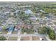 Expansive aerial view of a residential community featuring a central lake and tree-lined streets at 12805 Raysbrook Dr, Riverview, FL 33569