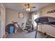 Bright exercise room with ceiling fan, treadmill, bike, and workout equipment at 12805 Raysbrook Dr, Riverview, FL 33569