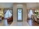 Bright foyer featuring tile flooring, chandelier, and dining and living spaces at 12805 Raysbrook Dr, Riverview, FL 33569