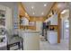Charming kitchen with white cabinetry, modern appliances, and a breakfast bar for casual dining at 12805 Raysbrook Dr, Riverview, FL 33569