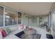 Covered lanai is furnished with comfortable seating at 12805 Raysbrook Dr, Riverview, FL 33569