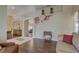 Comfortable living room boasts hardwood floors, stylish floral wall decor and lots of natural light at 12805 Raysbrook Dr, Riverview, FL 33569