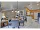 Open-concept living space featuring tile floors, modern lighting, and easy access to the kitchen at 12805 Raysbrook Dr, Riverview, FL 33569