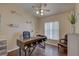 Office featuring a ceiling fan, desk, wood floors, and natural lighting at 12805 Raysbrook Dr, Riverview, FL 33569