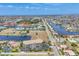 Expansive aerial view of waterfront property featuring multiple canals and lush greenery at 1349 Aqui Esta Dr # 143, Punta Gorda, FL 33950