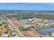 Aerial view of a coastal community with a beautiful waterfront and tropical landscaping at 1349 Aqui Esta Dr # 143, Punta Gorda, FL 33950