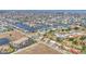 Wide aerial shot showcasing a residential area featuring numerous waterfront homes with canals at 1349 Aqui Esta Dr # 143, Punta Gorda, FL 33950