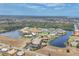 Stunning aerial view of waterfront community with multiple docks and beautiful landscaping at 1349 Aqui Esta Dr # 143, Punta Gorda, FL 33950
