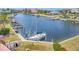 Condo in a waterfront community with boat slip and boat in the water, near landscaped common areas, and nearby pool at 1349 Aqui Esta Dr # 143, Punta Gorda, FL 33950