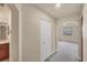 Hallway view featuring an archway, closet, and partial view of the bathroom and bedroom at 1349 Aqui Esta Dr # 143, Punta Gorda, FL 33950