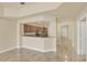 Open concept kitchen with wood cabinets and granite countertops at 1349 Aqui Esta Dr # 143, Punta Gorda, FL 33950