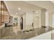 Kitchen with stainless steel sink, granite counters, and wood cabinets at 1349 Aqui Esta Dr # 143, Punta Gorda, FL 33950