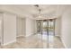 Bright living room with tile flooring, neutral walls and access to a screened in balcony at 1349 Aqui Esta Dr # 143, Punta Gorda, FL 33950
