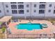 Enjoy community amenities in this waterfront community with pool, lounge chairs, tables and fencing around the pool at 1349 Aqui Esta Dr # 143, Punta Gorda, FL 33950
