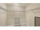 Walk-in closet featuring white walls, carpet, and metal shelving on all sides at 1349 Aqui Esta Dr # 143, Punta Gorda, FL 33950