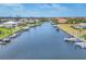 Condo in a waterfront community with boat slips and boats in the water, near landscaped common areas, and nearby pool at 1349 Aqui Esta Dr # 143, Punta Gorda, FL 33950