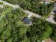 Aerial view of a modern home nestled in a natural setting, showcasing the property's greenery and quiet surroundings at 14009 Daniels Ave, Port Charlotte, FL 33953